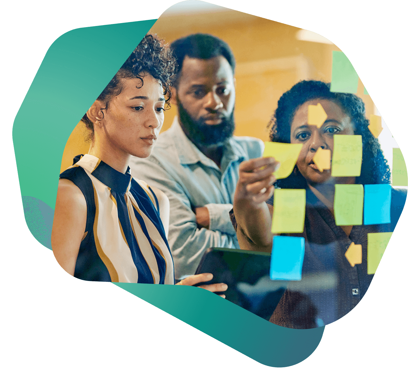 Team of financial professionals collaborating in front of a wall with sticky notes, reflecting strategic planning and solution design in lending.